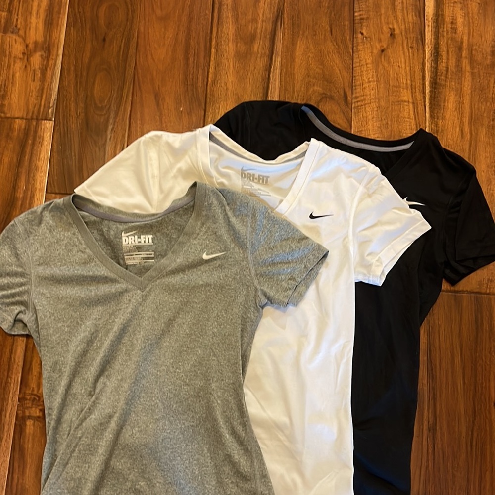 Three Nike dri-fit athletic shirts